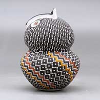 A polychrome owl figure decorated with a tiny square and geometric design, click or tap to see a larger version