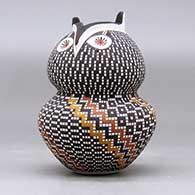 A polychrome owl figure decorated with a tiny square and geometric design, click or tap to see a larger version