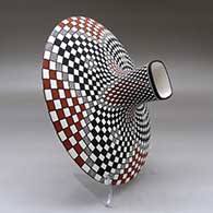 A polychrome low shouldered jar with a squarish neck and rim and decorated with a stylized checkerboard and geometric design, click or tap to see a larger version