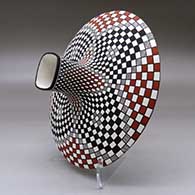 A polychrome low shouldered jar with a squarish neck and rim and decorated with a stylized checkerboard and geometric design, click or tap to see a larger version