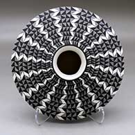 A black on white low shouldered jar decorated with a lightning bolt, fineline and geometric design
 by Paula Estevan of Acoma