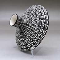 A black on white low shouldered jar decorated with a geometric design, click or tap to see a larger version