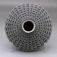 A black on white low shouldered jar decorated with a geometric design
 by Paula Estevan of Acoma