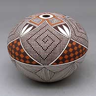 A polychrome seed pot decorated with a four panel snowflake fineline, checkerboard, tiny squares and geometric design
 by Robert Patricio of Acoma