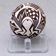 A miniature polychrome seed pot decorated with a Mimbres rabbit, fineline, checkerboard and geometric design
 by Diane Lewis of Acoma