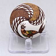 A miniature polychrome seed pot decorated with a bird, fineline and geometric design
 by Diane Lewis of Acoma