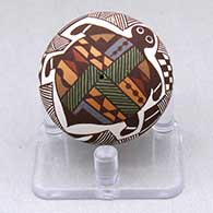 A miniature polychrome seed pot decorated with a turtle, fineline and geometric design
 by Diane Lewis of Acoma