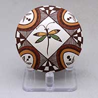 A polychrome seed pot decorated above the shoulder with a dragonfly, flower, checkerboard, fineline and geometric design
 by Diane Lewis of Acoma