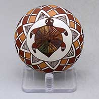 A polychrome seed pot decorated above the shoulder with a turtle, fineline and geometric design
 by Diane Lewis of Acoma