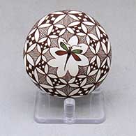 A polychrome seed pot decorated above the shoulder with a dragonfly, fineline and geometric design
 by Diane Lewis of Acoma