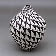 A polychrome vase decorated with a spiral mesa and snow geometric design
 by Sandra Victorino of Acoma