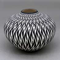 A black on white jar decorated with a lightning bolt geometric design
 by Paula Estevan of Acoma