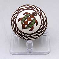 A miniature polychrome seed pot decorated with a turtle, spiral mesa and geometric design
 by Diane Lewis of Acoma