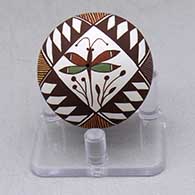 A miniature polychrome seed pot decorated with a dragonfly, plant and geometric design
 by Diane Lewis of Acoma