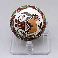 A miniature polychrome seed pot decorated with a parrot, branch, fineline and geometric design
 by Diane Lewis of Acoma