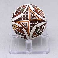 A miniature polychrome seed pot decorated with a fish and geometric design
 by Diane Lewis of Acoma