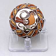 A miniature polychrome seed pot decorated with a parrot, branch and geometric design
 by Diane Lewis of Acoma