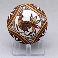 A polychrome seed pot decorated with a bird, rainbow, fineline and geometric design
 by Diane Lewis of Acoma