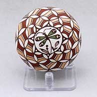 A polychrome seed pot decorated with a dragonfly and geometric design
 by Diane Lewis of Acoma