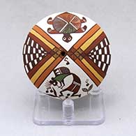 A polychrome seed pot decorated with a kokopelli, turtle, rainbow, checkerboard and geometric design
 by Diane Lewis of Acoma