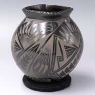 A black on black jar with a square, notched rim and 4-panel Paquime-style geometric design
 by Oscar Quezada of Mata Ortiz and Casas Grandes