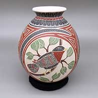 Polychrome jar with a flared opening and a three-panel sgraffito and painted bird, branch, leaf, and geometric design
 by Hilario Quezada Jr of Mata Ortiz and Casas Grandes