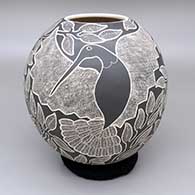 Black and white jar with a sgraffito hummingbird, flower, branch, and leaf design
 by Lorenza Quezada of Mata Ortiz and Casas Grandes