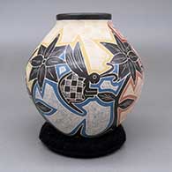 Polychrome jar with a sgraffito and painted bee, flower, and geometric design, click or tap to see a larger version