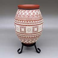 Polychrome jar with a slightly flared opening and a geometric design
 by Enrique Pedregon of Mata Ortiz and Casas Grandes
