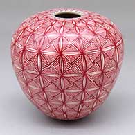 A red-on-white jar decorated with a cuadrillos geometric design
 by Aide Gonzales of Mata Ortiz and Casas Grandes