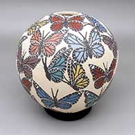 Polychrome jar with a sgraffito and painted butterfly design
 by Leticia Ledezma of Mata Ortiz and Casas Grandes