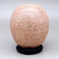 Red jar with a sgraffito fineline geometric design, click or tap to see a larger version