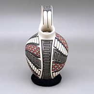 Polychrome wedding vase-style jar with a cuadrillos and geometric design, click or tap to see a larger version