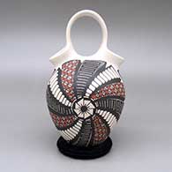 Polychrome wedding vase-style jar with a cuadrillos and geometric design, click or tap to see a larger version