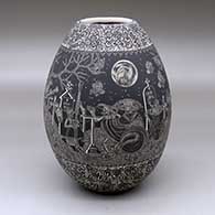 A black-on-white jar decorated with a band of sgraffito Night of the Dead at the Cemetery design with bands of sgraffito geometric design above and below
 by Hector Javier Martinez of Mata Ortiz and Casas Grandes