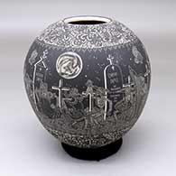 A black-on-white jar decorated with a band of sgraffito Day of the Dead at the Cemetery design between two bands of geometric design
 by Hector Javier Martinez of Mata Ortiz and Casas Grandes