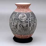A polychrome jar decorated with a sgraffito Night of the Dead and geometric design
 by Hector Javier Martinez of Mata Ortiz and Casas Grandes