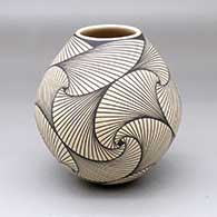 A black-on-tan jar decorated with a geometric design
 by Pilo Mora of Mata Ortiz and Casas Grandes