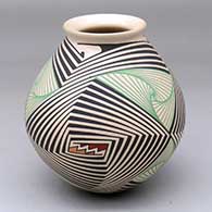 A polychrome jar with a flared lip and decorated with a three-panel swirling, spiraling fine line and geometric design
 by Pilo Mora of Mata Ortiz and Casas Grandes