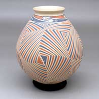 A polychrome jar decorated with an interlocking sharp spiral geometric design
 by Pilo Mora of Mata Ortiz and Casas Grandes