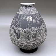 A black-and-white jar decorated with a sgraffito Night of the Dead at the Cemetery and geometric design
 by Hector Javier Martinez of Mata Ortiz and Casas Grandes