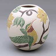 A polychrome jar decorated with a sgraffito-and-painted bird, branch, leaf and flower design
 by Valeria Lopez of Mata Ortiz and Casas Grandes