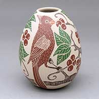 A polychrome jar decorated with a two-panel sgraffito-and-painted bird, branch, leaf and berry design
 by Guadalupe Melendez of Mata Ortiz and Casas Grandes