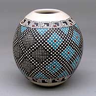 A polychrome jar decorated with a cuadrillos and geometric design
 by Armida Saenz of Mata Ortiz and Casas Grandes