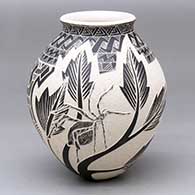 A black-and-white jar decorated with a sgraffito spider, plant and geometric design
 by Hector Quintana of Mata Ortiz and Casas Grandes