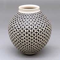 A black-on-cream jar decorated with a cuadrillos-based geometric design
 by Faby Veloz of Mata Ortiz and Casas Grandes