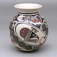 A polychrome jar with a rolled lip and decorated with a three-panel Mimbres mosquito and geometric design
 by Miguel Lopez of Mata Ortiz and Casas Grandes