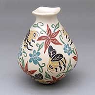 A polychrome vase with a square rim and decorated with a sgraffito-and-painted bumblebee, flower, leaf and geometric design
 by Carlos Corona of Mata Ortiz and Casas Grandes