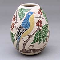 A polychrome jar decorated with a sgraffito-and-painted bird, branch, leaf and berry design
 by Guadalupe Melendez of Mata Ortiz and Casas Grandes