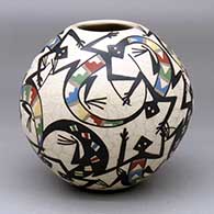 A polychrome jar decorated with a sgraffito lizard and geometric design
 by Karina Lozano of Mata Ortiz and Casas Grandes